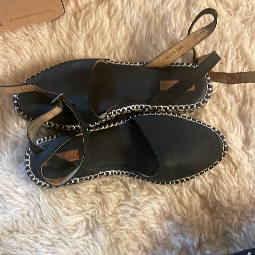 Black leather flats